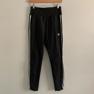 Woman’s Adidas sweatpants.